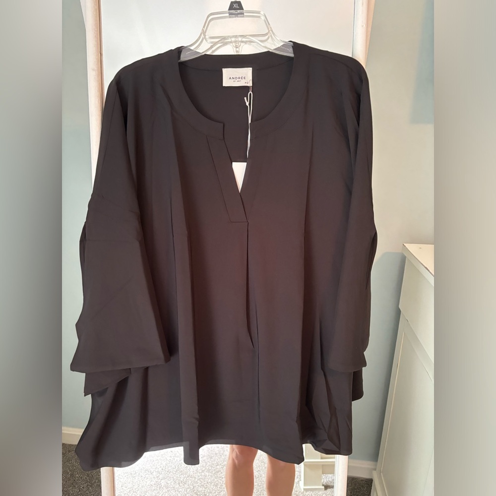 Poncho blouse in black. Will fit a 1X easily.